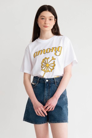 A YELLOW FLOWER SEED LOGO T_WHITE