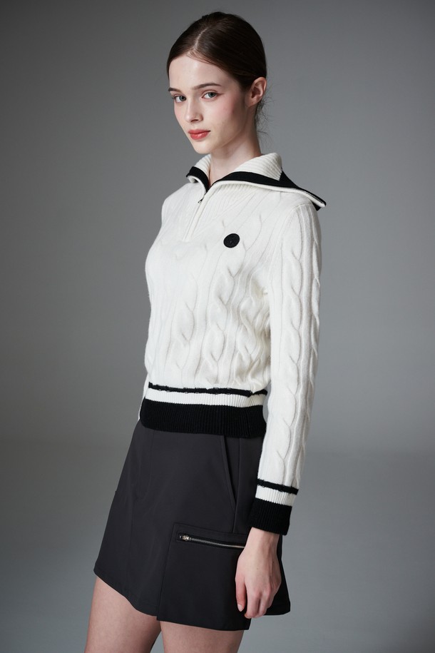 Keep warm A 라인 스커트 기모 A 라인 스커트는 여성 골프 및 일상용으로 적합한 겨울철 방한 스커트입니다. 부드러운 기모 안감과 두꺼운 두께로 보온성을 높였으며, A 라인 핏으로 편안한 착용감을 제공합니다. 블랙 컬러의 무지 디자인에 레귤러 핏으로 제작되었으며, 스포티하면서도 미니멀한 스타일을 연출합니다. 속바지가 포함되어 있어 활동적인 움직임에도 안정감을 더하며, 앞중심 오픈형 디자인으로 편리함을 더했습니다.
