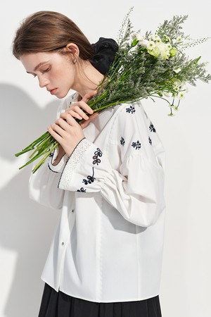 Embroidered ruffle button blouse