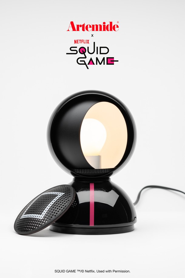 [Artemide] 오징어게임 에클리세 테이블 프론트맨은 넷플릭스(Netflix) 공식 라이센스 제품으로, 오징어 게임을 모티브로 한 한정판 조명입니다. 블랙 컬러의 스틸과 테크노폴리머 소재로 제작되었으며, 180mm x 120mm 사이즈입니다. 프론트맨 디자인이 특징이며, 제품 결함에 대해 7년 보증을 제공합니다. 테이블 조명 본체로 구성되어 있으며, 조명 기능을 제공합니다.
