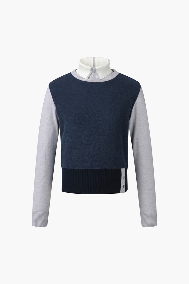 여성 방풍 탈부착 니트 풀오버 (DP42WFKPO6)는 봄, 가을 시즌 골프 활동에 적합한 스포티 스타일의 상의입니다. 부드러운 촉감의 나일론, 폴리에스터, 폴리우레탄, 레이온 혼방 소재로 제작되어 뛰어난 착용감을 선사합니다. 무지 디자인에 긴 소매와 니트넥으로 포인트를 주었으며, 레귤러핏으로 편안하게 착용 가능합니다. 방풍 기능과 탈부착 가능한 디자인으로 변덕스러운 날씨에도 유연하게 대응할 수 있어 골프룩으로 활용하기 좋습니다.
