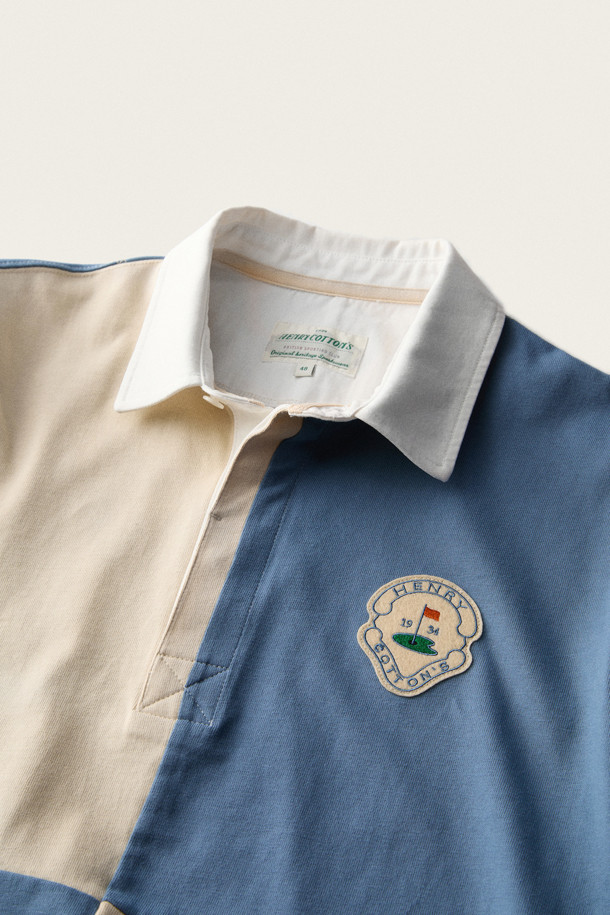 **브리티시 스포팅 클럽 플래드 긴소매 티셔츠**는 남성용 폴로 티셔츠로, 가을 시즌 일상복으로 적합합니다. 네이비, 베이지 색상으로 만나볼 수 있으며, 클래식과 스포티한 무드를 동시에 연출합니다. 면 소재로 제작되어 부드러운 촉감이 특징이며, 4분할 배색의 패치워크 패턴이 돋보입니다. 립 마감 처리와 B.S.C 로고, 펠트 소재 아플리케 아트워크 디테일이 돋보이며, 데이트룩, 모임룩, 캐주얼 스타일에 매치하기 좋습니다. 클래식 핏의 긴소매 폴로 티셔츠입니다.
