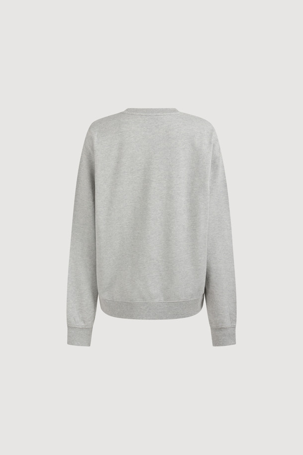 LUCKY CHOUETTE (럭키슈에뜨)의 Chouetties 리본 포인트 스웨트셔츠 (멜란지 그레이)입니다. 부드러운 코튼 미니 쮸리 소재로 제작되어 편안한 착용감을 선사합니다. 캐주얼하고 빈티지한 무드를 연출하며, 루즈핏 디자인으로 활동성을 높였습니다. 소매와 밑단은 시보리 처리되었으며, 볼륨감 있는 리본 자수와 레터링 자수가 포인트로 더해져 사랑스러운 느낌을 줍니다. 봄, 가을 동네 마실룩이나 봄 소풍룩으로 활용하기 좋습니다.
