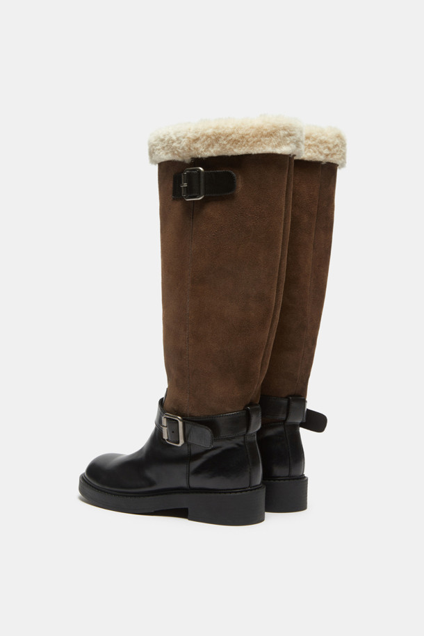 Furridge(퍼리지) shearling(시어링) 롱 부츠(블랙)는 여성 고객을 위한 겨울철 필수 아이템입니다. 소가죽, 스웨이드, 페이크 퍼 등 다양한 소재의 조화가 돋보이며, 안감 전체는 보온성을 높이는 퍼로 마감되었습니다. 측면 실버 메탈 버클 스트랩과 퍼 디테일 탑라인이 스타일리시함을 더하며, 무지 디자인으로 어떤 스타일에도 쉽게 매치할 수 있습니다. 출근룩, 연말 모임룩 등 다양한 TPO에 활용 가능하며, 캐주얼, 클래식, 미니멀 스타일을 즐겨 입는 고객에게 추천합니다.
